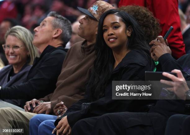 Singer H.E.R. Smiles court side during a 118-100 Minnesota Timberwolves win over the LA Clippers at Crypto.com Arena on March 12, 2024 in Los...