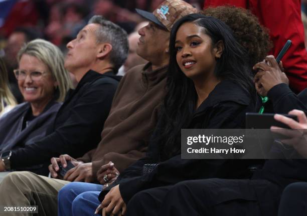 Singer H.E.R. Smiles court side during a 118-100 Minnesota Timberwolves win over the LA Clippers at Crypto.com Arena on March 12, 2024 in Los...