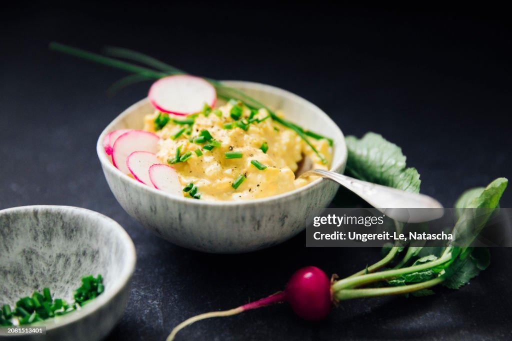 Egg salad garnished with radishes and chives