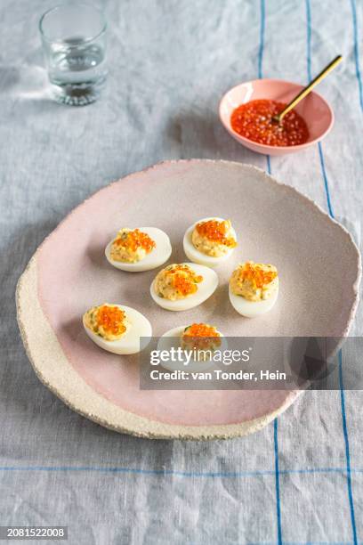 deviled eggs topped with caviar - deviled egg stock pictures, royalty-free photos & images
