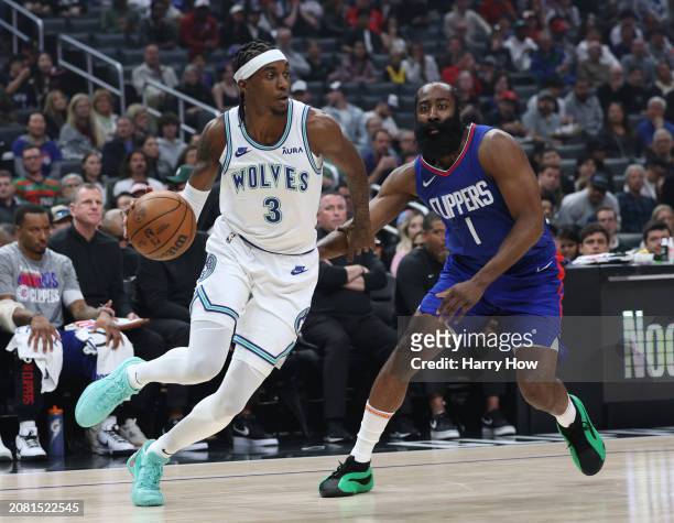 Jaden McDaniels of the Minnesota Timberwolves drives to the basket past James Harden of the LA Clippers during a 118-100 Timberwolves win at...