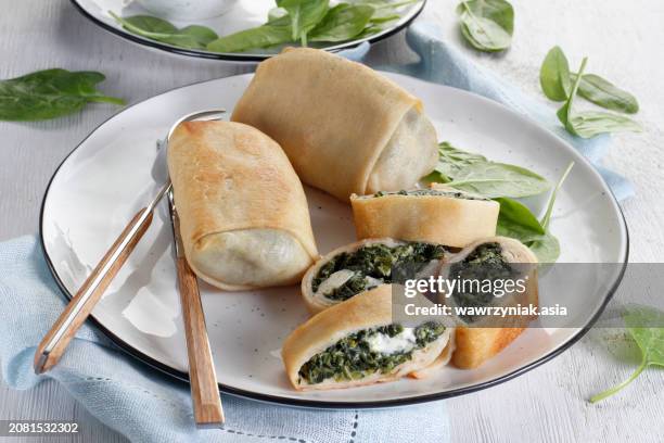 fried pancake rolls with spinach and ricota - protein pancakes stock pictures, royalty-free photos & images