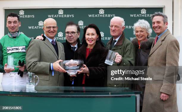 Trainer Willie Mullins looks on alongside Wife Jackie Mullins Jockey and Son Patrick Mullins connections as Jasmin De Vaux ridden by Patrick Mullins...