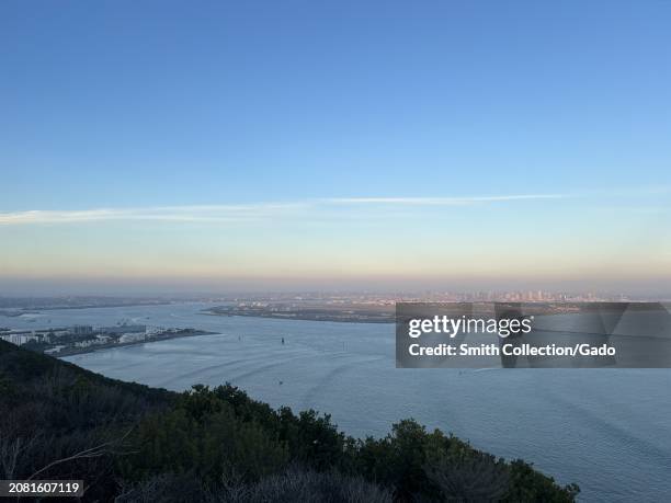 Dusk view overlooking the San Diego Bay and city skyline from Cabrillo National Monument, San Diego, California, December 28, 2023.