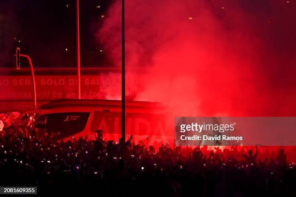 General view as fans set off red flares outside the stadium as a team coach arrives prior to the UEFA Champions League 2023/24 round of 16 second leg...