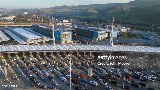 In an aerial view, morning commuter traffic waits to cross into the United States from Tijuana, Mexico on March 6, 2024 in San Ysidro, California....