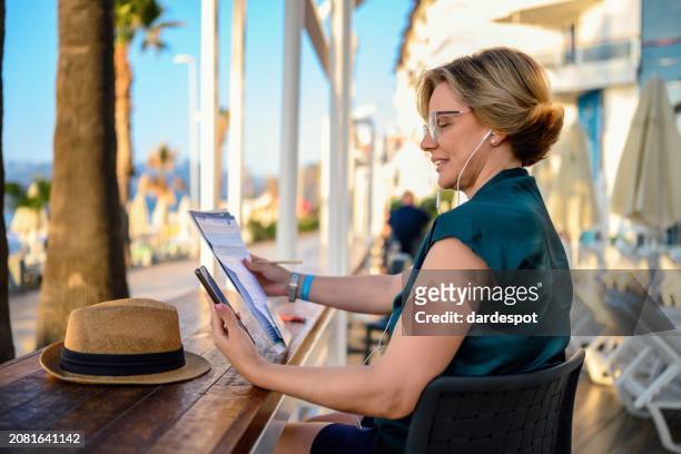businesswoman working with a smartphone - sea iphone stock pictures, royalty-free photos & images