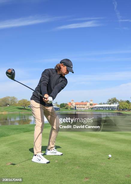 This image is part of a swing sequence; Tommy Fleetwood of England plays a small headed 12 degree driver off the 18th tee during his practice round...