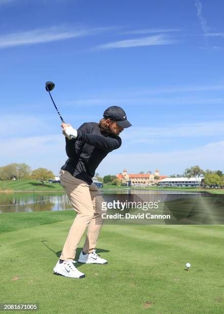 This image is part of a swing sequence; Tommy Fleetwood of England plays a small headed 12 degree driver off the 18th tee during his practice round...