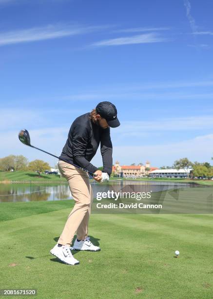 This image is part of a swing sequence; Tommy Fleetwood of England plays a small headed 12 degree driver off the 18th tee during his practice round...