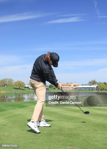 This image is part of a swing sequence; Tommy Fleetwood of England plays a small headed 12 degree driver off the 18th tee during his practice round...