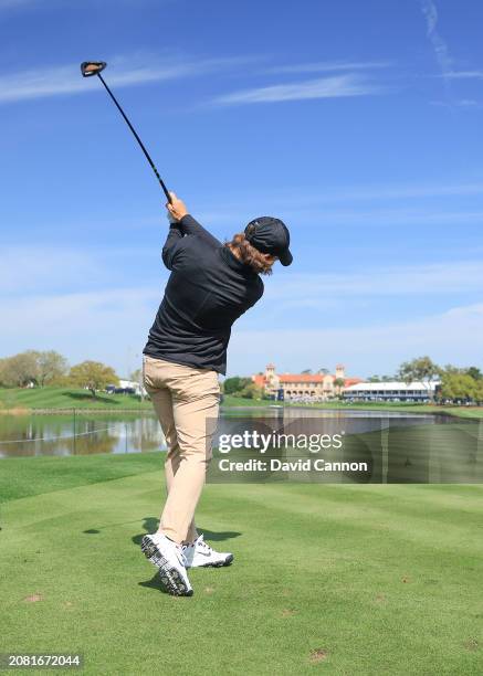 This image is part of a swing sequence; Tommy Fleetwood of England plays a small headed 12 degree driver off the 18th tee during his practice round...