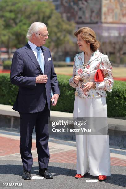 King Carl XVI Gustaf of Sweden and Queen Silvia of Sweden talk during a visit to Universidad Nacional Autonoma de Mexico to sign a cooperation...