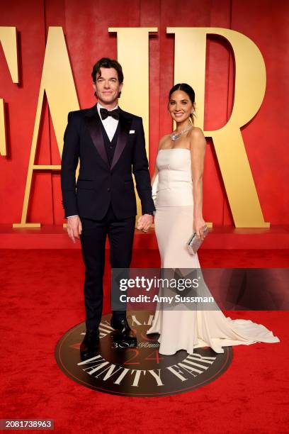 John Mulaney and Olivia Munn attend the 2024 Vanity Fair Oscar Party Hosted By Radhika Jones at Wallis Annenberg Center for the Performing Arts on...