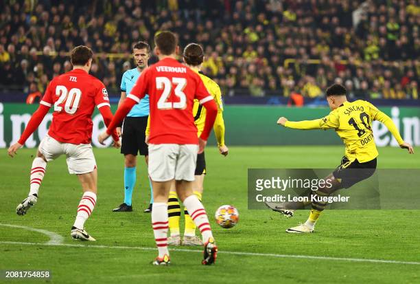 Jadon Sancho of Borussia Dortmund scores his team's first goal during the UEFA Champions League 2023/24 round of 16 second leg match between Borussia...