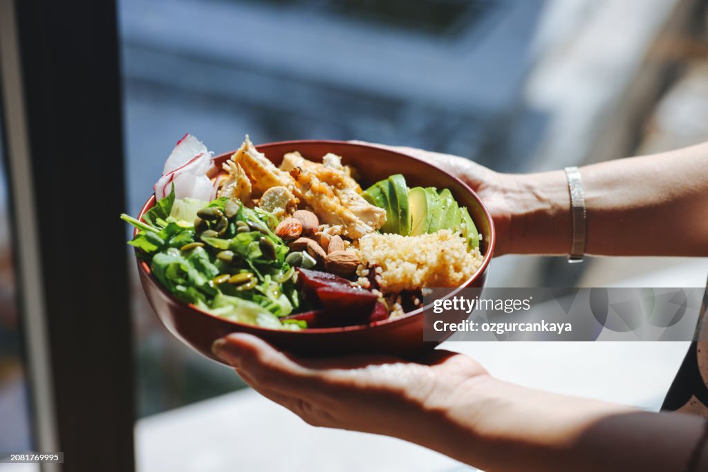 Holding a bowl of chicken salad