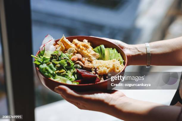 holding a bowl of chicken salad - serving size stock pictures, royalty-free photos & images