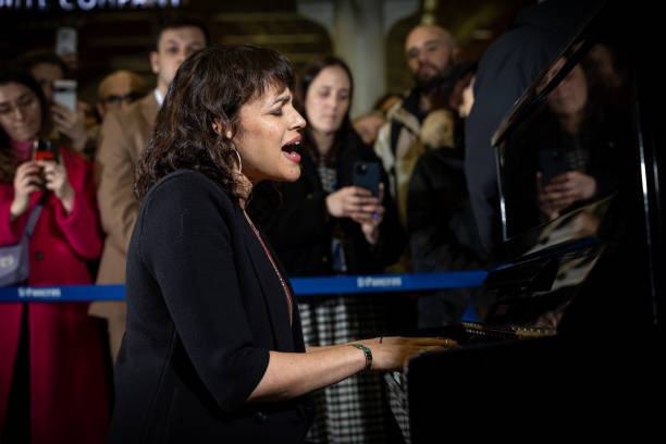 GBR: Norah Jones Performs On Elton John's Piano At St. Pancras Station