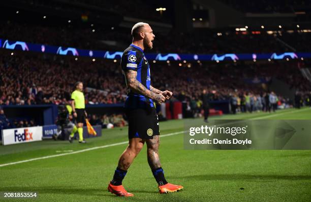Federico Dimarco of FC Internazionale celebrates scoring his team's first goal during the UEFA Champions League 2023/24 round of 16 second leg match...
