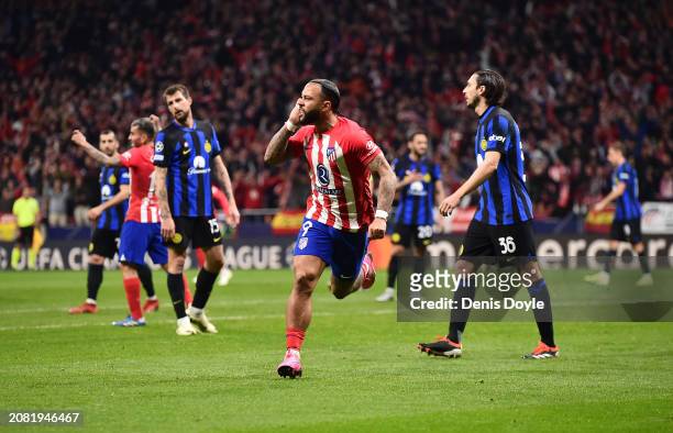 Memphis Depay of Atletico Madrid celebrates scoring his team's second goal during the UEFA Champions League 2023/24 round of 16 second leg match...