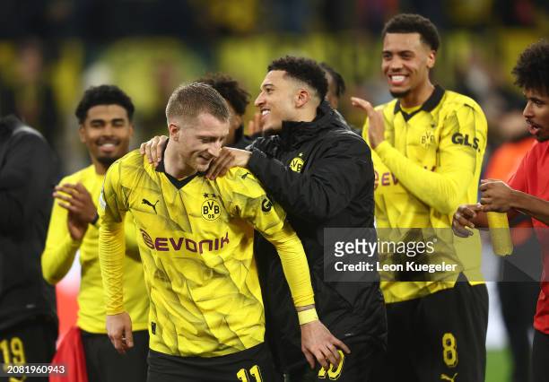 Marco Reus and Jadon Sancho of Borussia Dortmund celebrate victory in the UEFA Champions League 2023/24 round of 16 second leg match between Borussia...