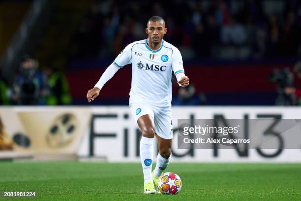 Juan Jesus of SSC Napoli runs with the ball during the UEFA Champions League 2023/24 round of 16 second leg match between FC Barcelona and SSC Napoli...