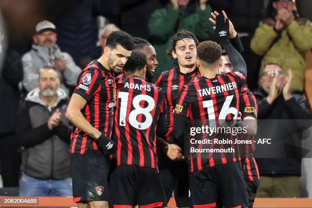 Antoine Semenyo of Bournemouth is congratulated by team-mates Dominic Solanke, Lewis Cook, Marcus Tavernier, Tyler Adams and Enes Unal after he...