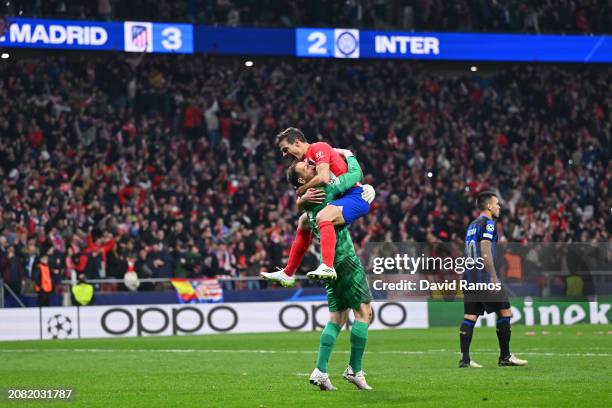 Jan Oblak and Cesar Azpilicueta of Atletico Madrid celebrate following the team's victory in the penalty shoot out during the UEFA Champions League...