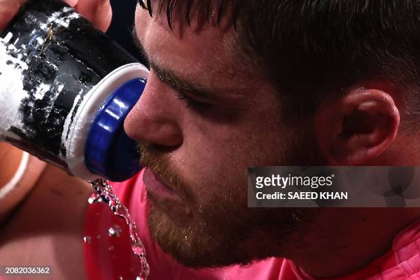 Waratahs' Fergus Lee-Warner drinks water during the Super Rugby match between the NSW Waratahs and the Blues in Sydney on March 16, 2024. / -- IMAGE...