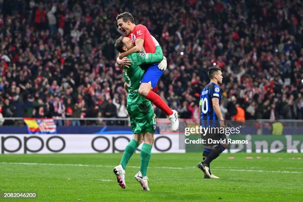 Jan Oblak and Cesar Azpilicueta of Atletico Madrid celebrate following the team's victory in the penalty shoot out during the UEFA Champions League...