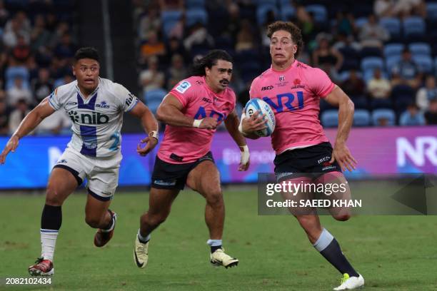 Waratahs' Mark Nawaqanitawase runs the ball during the Super Rugby match between the NSW Waratahs and the Blues in Sydney on March 16, 2024. / --...