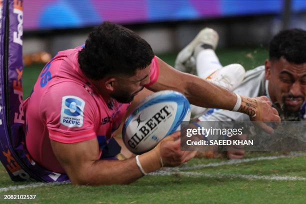 Waratahs' Triston Reilly dives for an unsuccessful try during the Super Rugby match between the NSW Waratahs and the Blues in Sydney on March 16,...