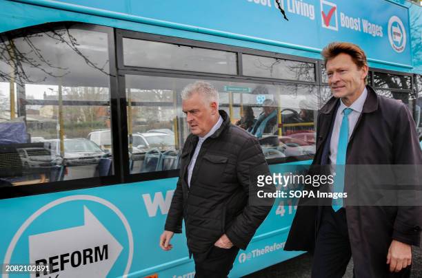 Leader of Reform UK, Richard Tice and Lee Anderson make their way back to the open-top Reform UK battle bus before moving to a new location during...