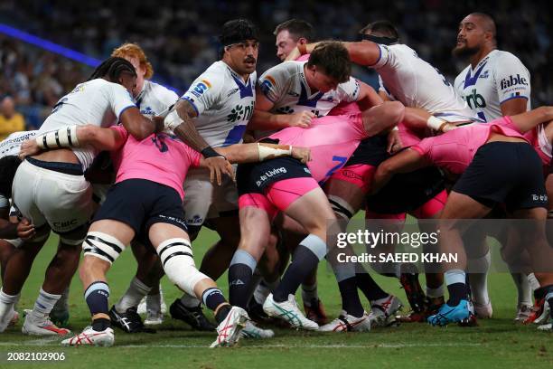 Blues and Waratahs players battle it out in a maul during the Super Rugby match between the NSW Waratahs and the Blues in Sydney on March 16, 2024. /...