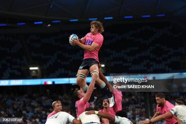 Waratahs' Ned Hanigan wins a lineout during the Super Rugby match between the NSW Waratahs and the Blues in Sydney on March 16, 2024. / -- IMAGE...