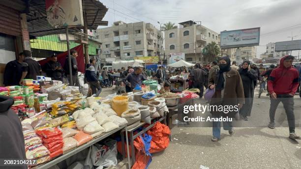 In a market set up on the streets of Rafah city during the holy month of Ramadan, market vendors sold what little food and basic life necessities...