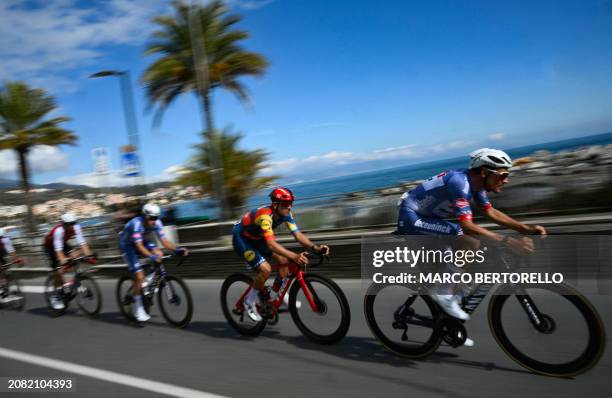 The pack rides along the coastline, during the 115th Milan-SanRemo one-day classic cycling race, between Pavia and SanRemo, on March 16, 2024.