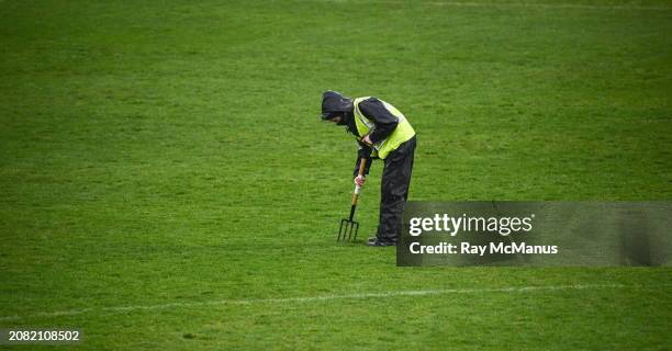 Wexford , Ireland - 16 March 2024; A groundsman repairs the ground at half time during the Allianz Hurling League Division 1 Group A match between...