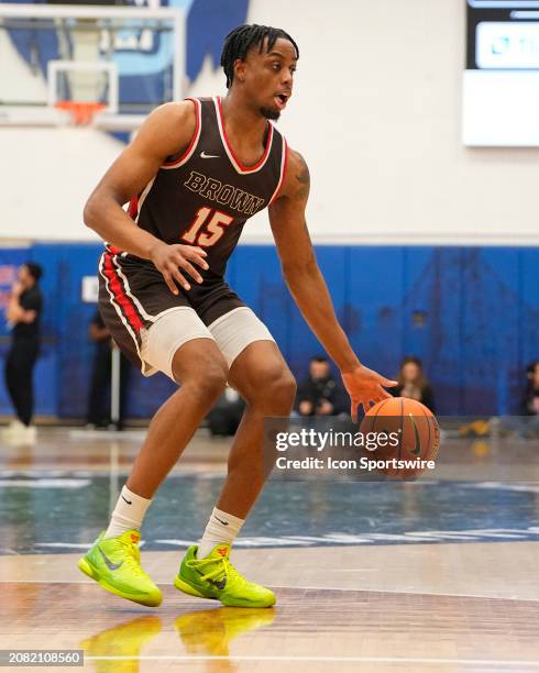 Brown Bears Forward Kalu Anya dribbles the ball during the first half of the Men's College Basketball Ivy League Championship Semi-Final game between...