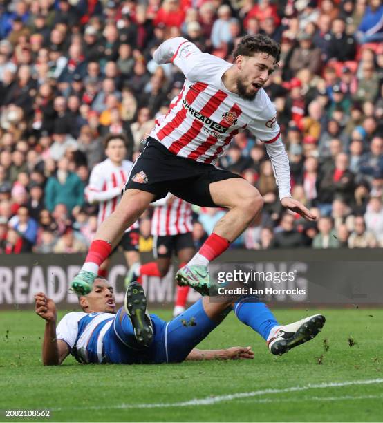 Adil Aouchiche of Sunderland is tackled as he takes his shot during the Sky Bet Championship match between Sunderland and Queens Park Rangers at...