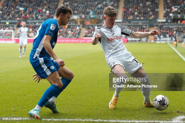 Perry Ng of Cardiff City and Przemyslaw Placheta of Swansea City in action during the Sky Bet Championship match between Swansea City and Cardiff...