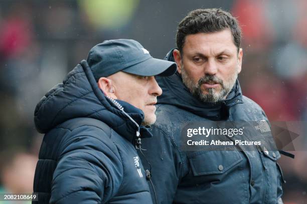 Cardiff City assistant coach Nikolaos Karydas is spoken to by Cardiff City manager Erol Bulut watch the game during the Sky Bet Championship match...