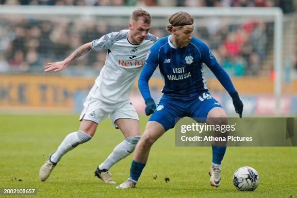 Josh Tymon of Swansea City and Josh Bowler of Cardiff City during the Sky Bet Championship match between Swansea City and Cardiff City at the...