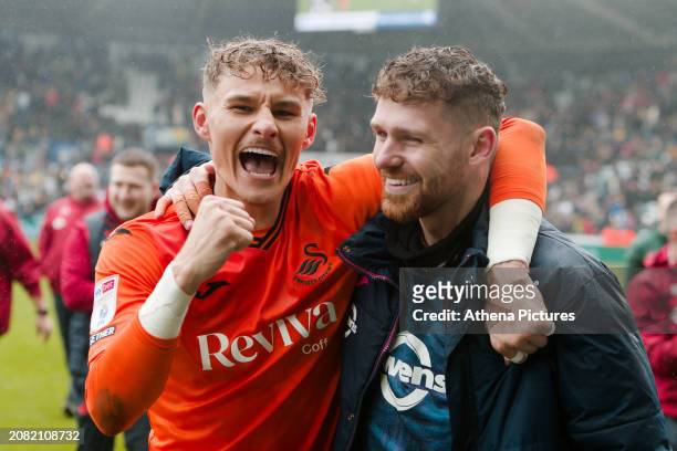 Carl Rushworth and Andy Fisher of Swansea City celebrate after the Sky Bet Championship match between Swansea City and Cardiff City at the...