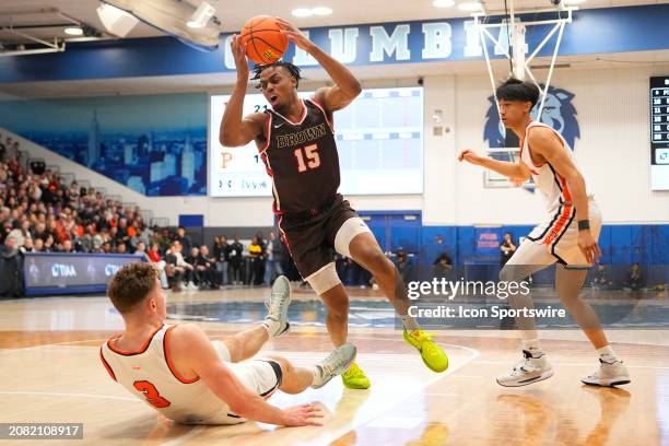 Brown Bears Forward Kalu Anya drives the ball against Princeton Tigers Forward Caden Pierce during the first half of the Men's College Basketball Ivy...