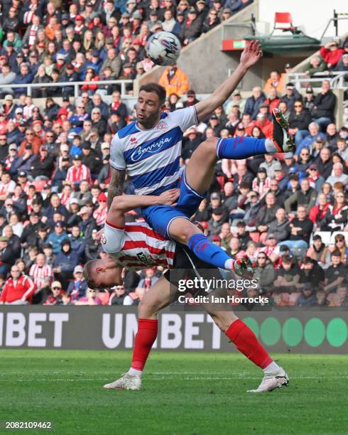 Dan Ballard of Sunderland feels the weight of Steve Cook of QPR during the Sky Bet Championship match between Sunderland and Queens Park Rangers at...