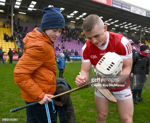 Wexford , Ireland - 16 March 2024; Tommy O'Connell of Cork signs a hurl after the Allianz Hurling League Division 1 Group A match between Wexford and...