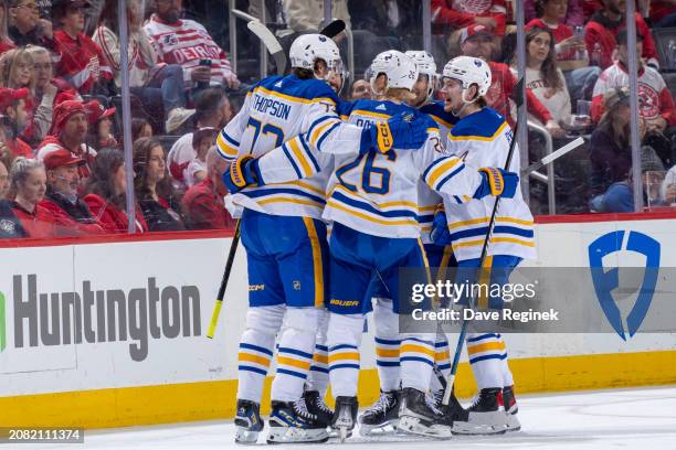 Tage Thompson of the Buffalo Sabres celebrates his goal against the Detroit Red Wings with teammates during the first period at Little Caesars Arena...