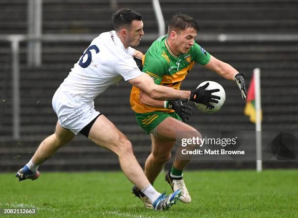 Carlow , Ireland - 16 March 2024; Peadar Morgan of Donegal in action against Eoin Doyle of Kildare during the Allianz Football League Division 2...