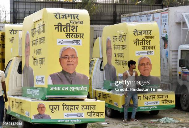 Labours preparing campaigning vans of Bihar Chief Minister and JDU national president Nitish Kumar for Lok Sabha elections 2024 at Millar School...